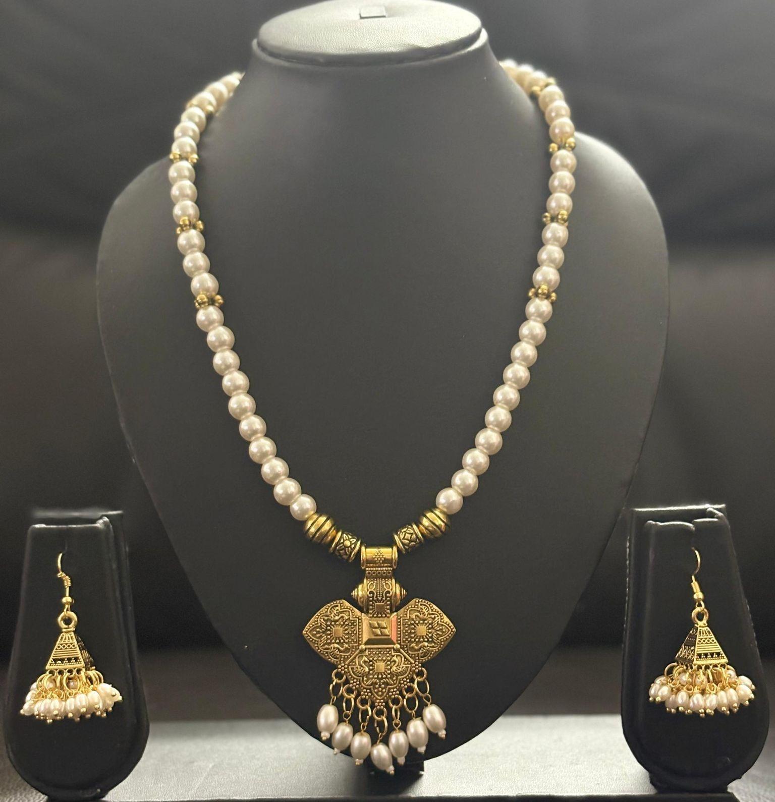  Handcrafted white pearl long chain paired wi